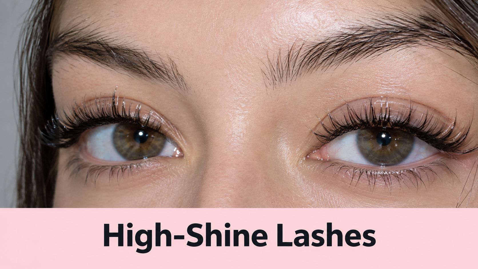 A close-up view of a woman with long, voluminous, high-shine eyelash extensions on her eyes.