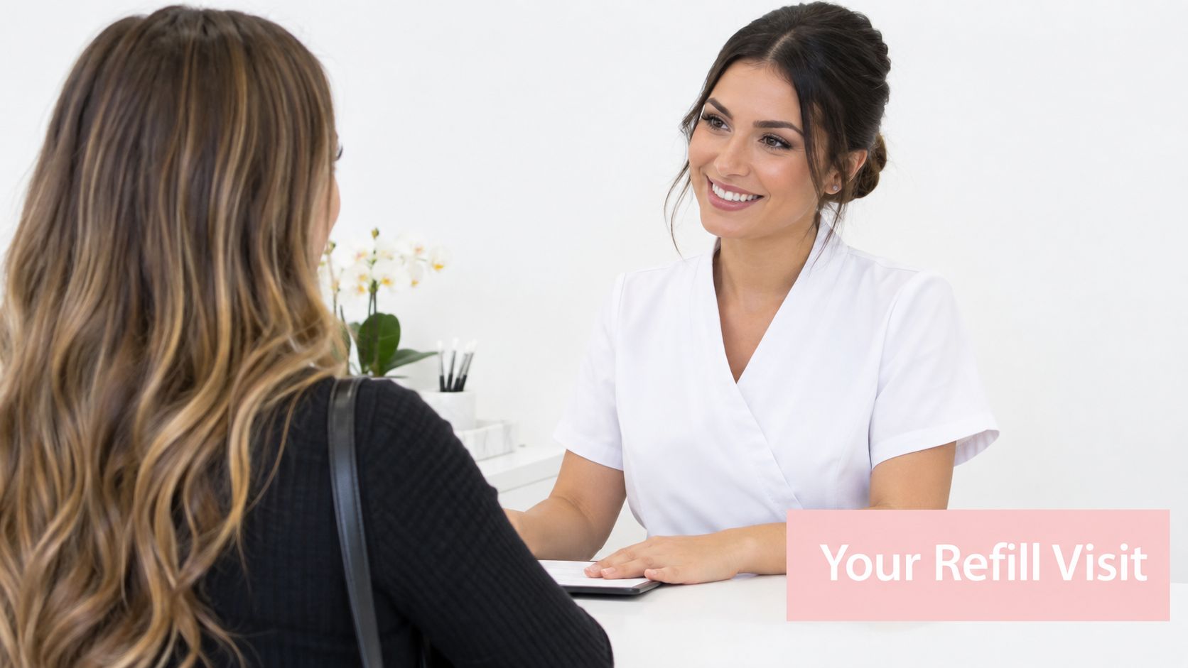 Lash Extension Refill in Sydney: A Complete Guide 4 A professional eyelash technician smiling while consulting with a client during an appointment at a beauty salon.