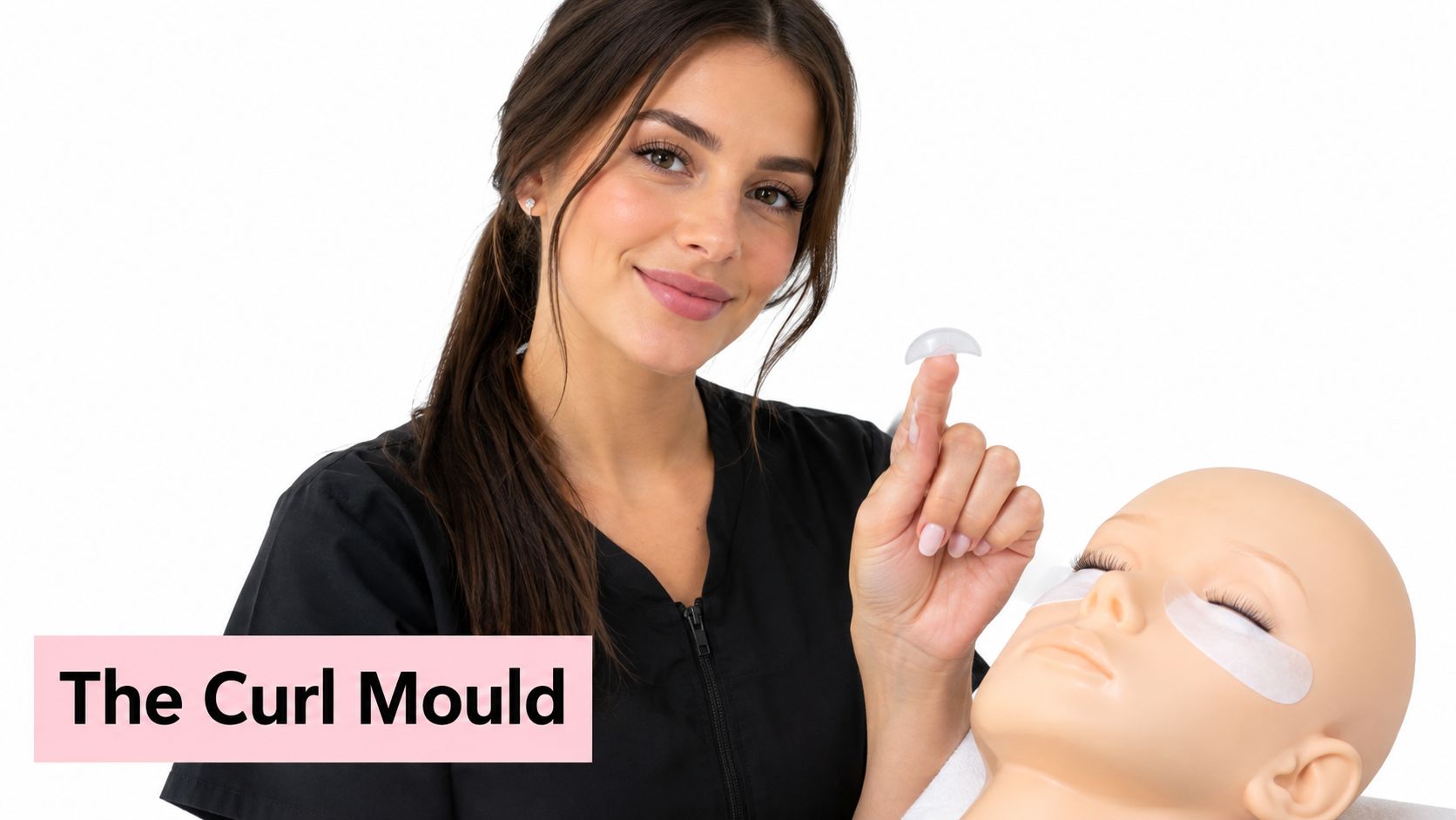 Lash Lift Shields Explained: The Ultimate Guide 10 A professional esthetician holding a clear silicone lash lift shield next to a mannequin head for training.